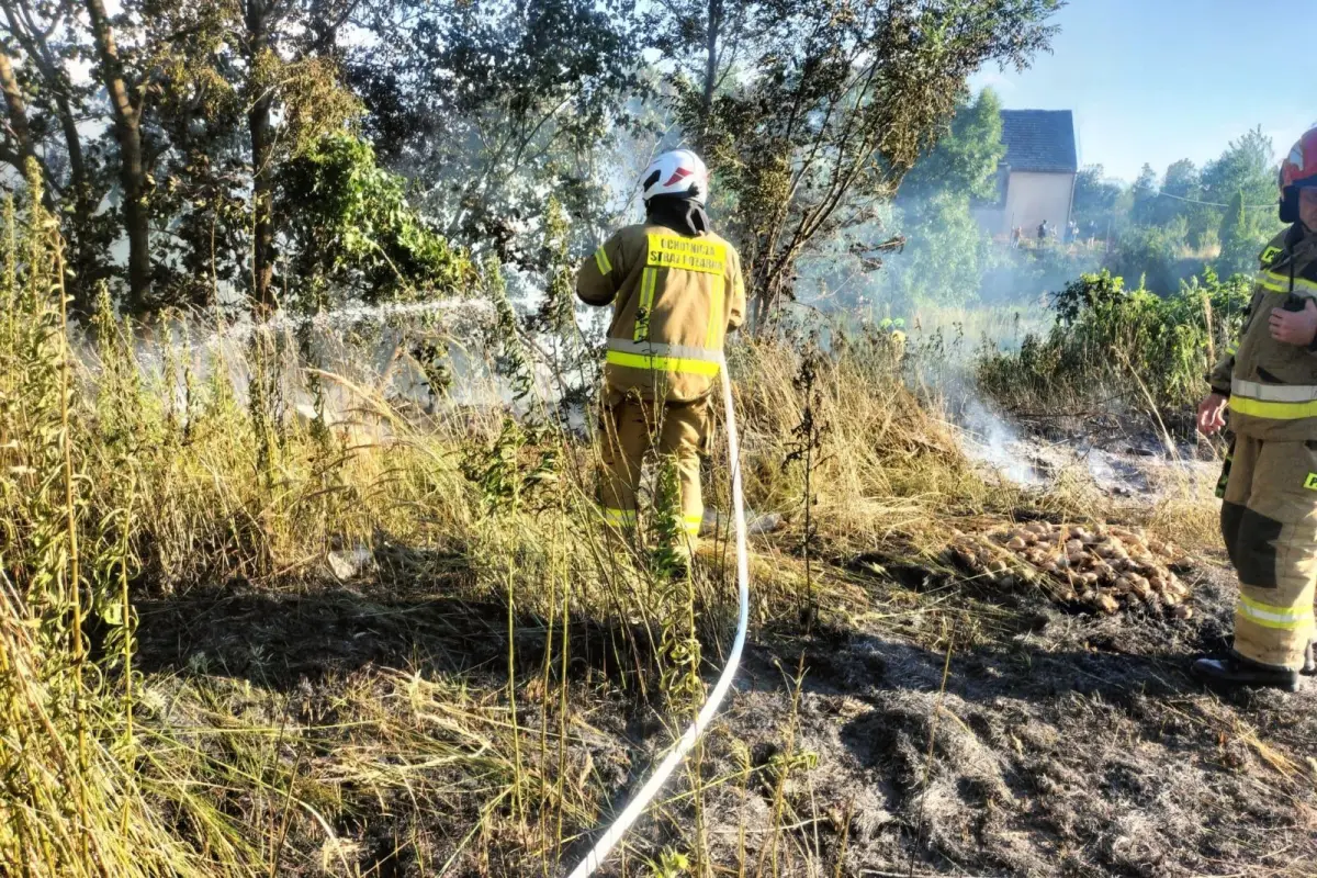Firefighters extinguishing a fire in Iwiny