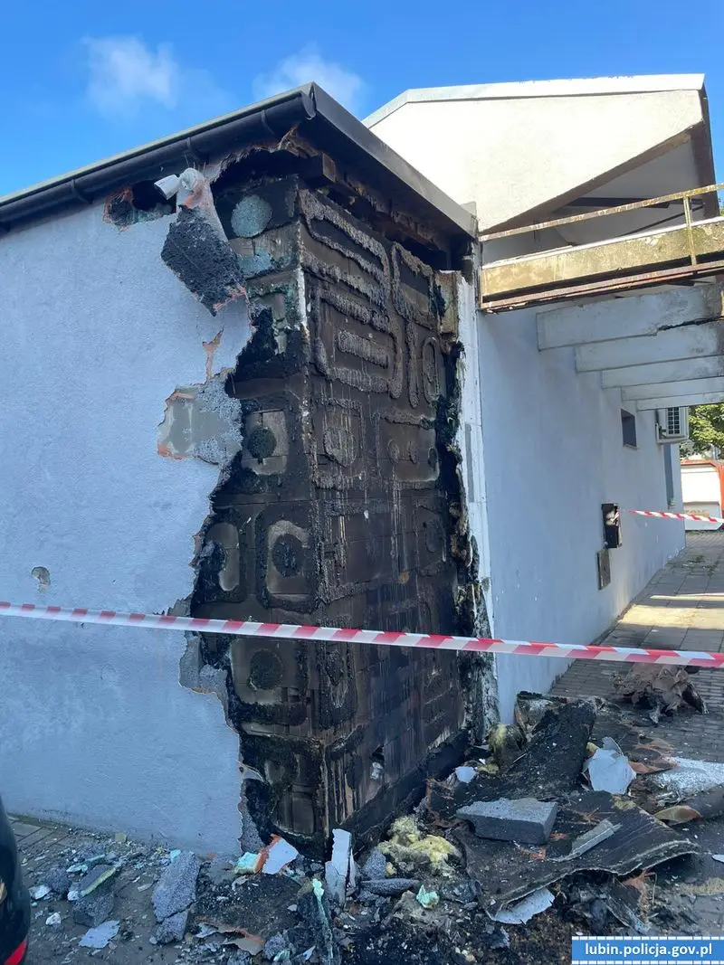 Suspect and burned building