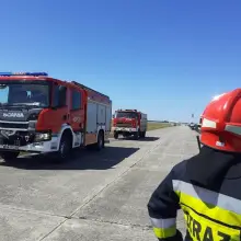View photo: Firefighters respond to a fire at a racetrack in the zone