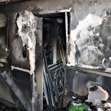 View photo: Burned garage and suspect