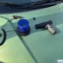 View photo: Suspect, so-called beacon and replica gun
